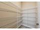 Walk-in pantry with ample shelving for organized storage at 4089 Windcrest Dr, Wesley Chapel, FL 33544