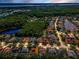 A beautiful aerial view of the neighborhood's homes, trees, and lakes at 4133 Auston Way, Palm Harbor, FL 34685
