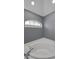 Close-up shot of a jacuzzi tub with tile surround and window in bathroom at 4133 Auston Way, Palm Harbor, FL 34685