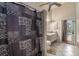 The bathroom features patterned curtains, and dual sinks, combining style and function at 4303 Kipling Ave, Plant City, FL 33566