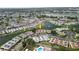 Community aerial view showcasing waterfront homes surrounded by scenic lakes and lush landscaping at 4324 Tahitian Gardens Cir # J, Holiday, FL 34691