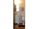 Compact bathroom featuring tiled floors, a vanity, and a toilet at 4324 Tahitian Gardens Cir # J, Holiday, FL 34691