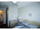 Bright bedroom featuring a ceiling fan and ensuite bathroom at 4324 Tahitian Gardens Cir # J, Holiday, FL 34691