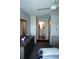 Cozy bedroom featuring soft carpeting and ensuite bathroom with tile flooring at 4324 Tahitian Gardens Cir # J, Holiday, FL 34691