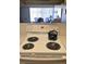 A well-maintained kitchen features standard appliances and a view into the cozy living area at 4324 Tahitian Gardens Cir # J, Holiday, FL 34691