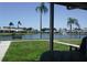 Relaxing patio view overlooking a serene lake with a fountain and lush landscaping at 4324 Tahitian Gardens Cir # J, Holiday, FL 34691