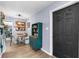 Charming dining area with vintage cabinet is conveniently located just off the kitchen at 4425 W Bay Ave, Tampa, FL 33616