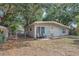 Charming home exterior with tidy yard, two entry doors, and outdoor seating; a welcoming view at 4425 W Bay Ave, Tampa, FL 33616