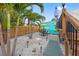 Tropical landscaped yard featuring a dining area and a palm tree at 4570 67Th N St, St Petersburg, FL 33709