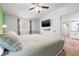 Bright bedroom with tv, ceiling fan, and adjacent dining room at 4570 67Th N St, St Petersburg, FL 33709
