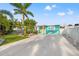 Beautiful updated home featuring a bright, attractive exterior, manicured lawn and a concrete driveway at 4570 67Th N St, St Petersburg, FL 33709