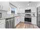Bright kitchen equipped with stainless steel appliances, granite countertops, and white subway tile backsplash at 4570 67Th N St, St Petersburg, FL 33709