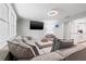 Comfortable living room featuring a large sectional couch, TV, and contemporary decor at 4570 67Th N St, St Petersburg, FL 33709