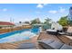 Relaxing backyard with pool and lounge chairs, perfect for soaking up the sun and enjoying outdoor living at 4570 67Th N St, St Petersburg, FL 33709