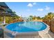 Full view of the backyard above ground pool with custom coping at 4570 67Th N St, St Petersburg, FL 33709