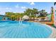 Inviting backyard pool area with lounge chairs, a deck, and privacy landscaping, ideal for relaxation at 4570 67Th N St, St Petersburg, FL 33709