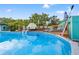 Above-ground pool with sundeck features lounge chairs and dining area at 4570 67Th N St, St Petersburg, FL 33709