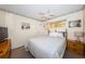 Cozy bedroom with a ceiling fan, decorated border, and neutral tones that create a relaxing atmosphere at 4750 Cove Cir # 1001, St Petersburg, FL 33708