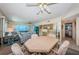 Open floor plan with cozy seating, dining space, and water views at 4750 Cove Cir # 1001, St Petersburg, FL 33708