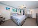 Inviting main bedroom features calm decor, ample closet space, and plush carpeting at 4750 Cove Cir # 1001, St Petersburg, FL 33708