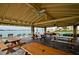 Covered picnic area with tables and seating near the water at 4750 Cove Cir # 1001, St Petersburg, FL 33708