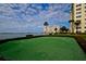 Community putting green overlooking the water at this condo complex at 4750 Cove Cir # 1001, St Petersburg, FL 33708