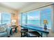 Bright seating area with a large picture window offering stunning panoramic views of the bay at 4750 Cove Cir # 1001, St Petersburg, FL 33708