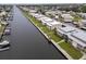 Scenic aerial view of waterfront condo community featuring boat docks and lush landscaping at 4812 Jasper Dr # 203, New Port Richey, FL 34652
