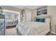 Bright bedroom with a large picture window, comfortable bedding, and soothing decor that creates a relaxing retreat at 4812 Jasper Dr # 203, New Port Richey, FL 34652
