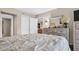 Cozy bedroom with soft lighting and a view into the en suite bath area, adding convenience and style at 4812 Jasper Dr # 203, New Port Richey, FL 34652