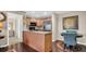 Well-equipped kitchen with stainless steel appliances and a breakfast bar counter at 4812 Jasper Dr # 203, New Port Richey, FL 34652