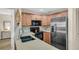 Updated kitchen with granite countertops, stainless steel appliances, and ample cabinet space at 4812 Jasper Dr # 203, New Port Richey, FL 34652