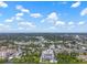 Expansive aerial view of a coastal community and the high-rise condo building, offering stunning views of the area at 500 N Osceola Ave # 811, Clearwater, FL 33755