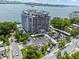 Breathtaking aerial view of the waterfront high-rise condo building, showcasing the coastal community and scenic views at 500 N Osceola Ave # 811, Clearwater, FL 33755