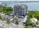 An aerial view showcases the building, its waterfront location and parking at 500 N Osceola Ave # 811, Clearwater, FL 33755