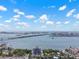 Elevated view showcases the building with bay views, boats and bridges on a sunny day at 500 N Osceola Ave # 811, Clearwater, FL 33755