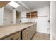 Bathroom featuring a large mirror, long vanity, and great natural light at 500 N Osceola Ave # 811, Clearwater, FL 33755