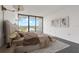 Bright bedroom with big windows, art, and elegant bed at 500 N Osceola Ave # 811, Clearwater, FL 33755