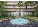 Beautiful courtyard with fountain, tropical landscaping and walkways in a residential community at 500 N Osceola Ave # 811, Clearwater, FL 33755