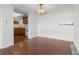 Dining area featuring wood floors, a window, and a chandelier adjacent to the kitchen at 500 N Osceola Ave # 811, Clearwater, FL 33755