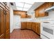 The kitchen shows plentiful wooden cabinets and bright overhead lighting at 500 N Osceola Ave # 811, Clearwater, FL 33755