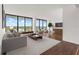 Bright living room featuring expansive windows with stunning city views and stylish furnishings at 500 N Osceola Ave # 811, Clearwater, FL 33755