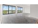 Large living room ready for furnishing, boasting floor-to-ceiling windows and balcony access at 500 N Osceola Ave # 811, Clearwater, FL 33755