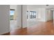 View of an empty living room and balcony through a doorway at 500 N Osceola Ave # 811, Clearwater, FL 33755