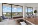 Bright living room with hardwood floors and a stunning balcony view at 500 N Osceola Ave # 811, Clearwater, FL 33755
