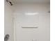 Shower featuring a tiled wall, grab bar, shower head, and soap dish at 500 N Osceola Ave # 811, Clearwater, FL 33755