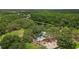 A small lake with a water feature next to a playground area that is surrounded by mature trees at 5100 Burchette Rd # 2702, Tampa, FL 33647
