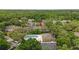 Aerial view of community pool with hot tub, surrounded by condos and mature trees at 5100 Burchette Rd # 2702, Tampa, FL 33647