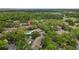 Aerial view of a condo community featuring a pool, mature trees, and well-maintained grounds at 5100 Burchette Rd # 2702, Tampa, FL 33647