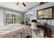 This is a well-lit bedroom with a neutral color scheme, mirrored closet, and a quaint desk area at 5100 Burchette Rd # 2702, Tampa, FL 33647
